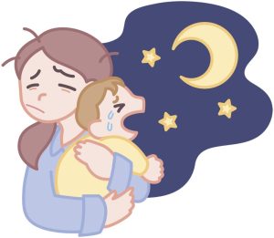 夜泣きの赤ちゃんをあやす母親